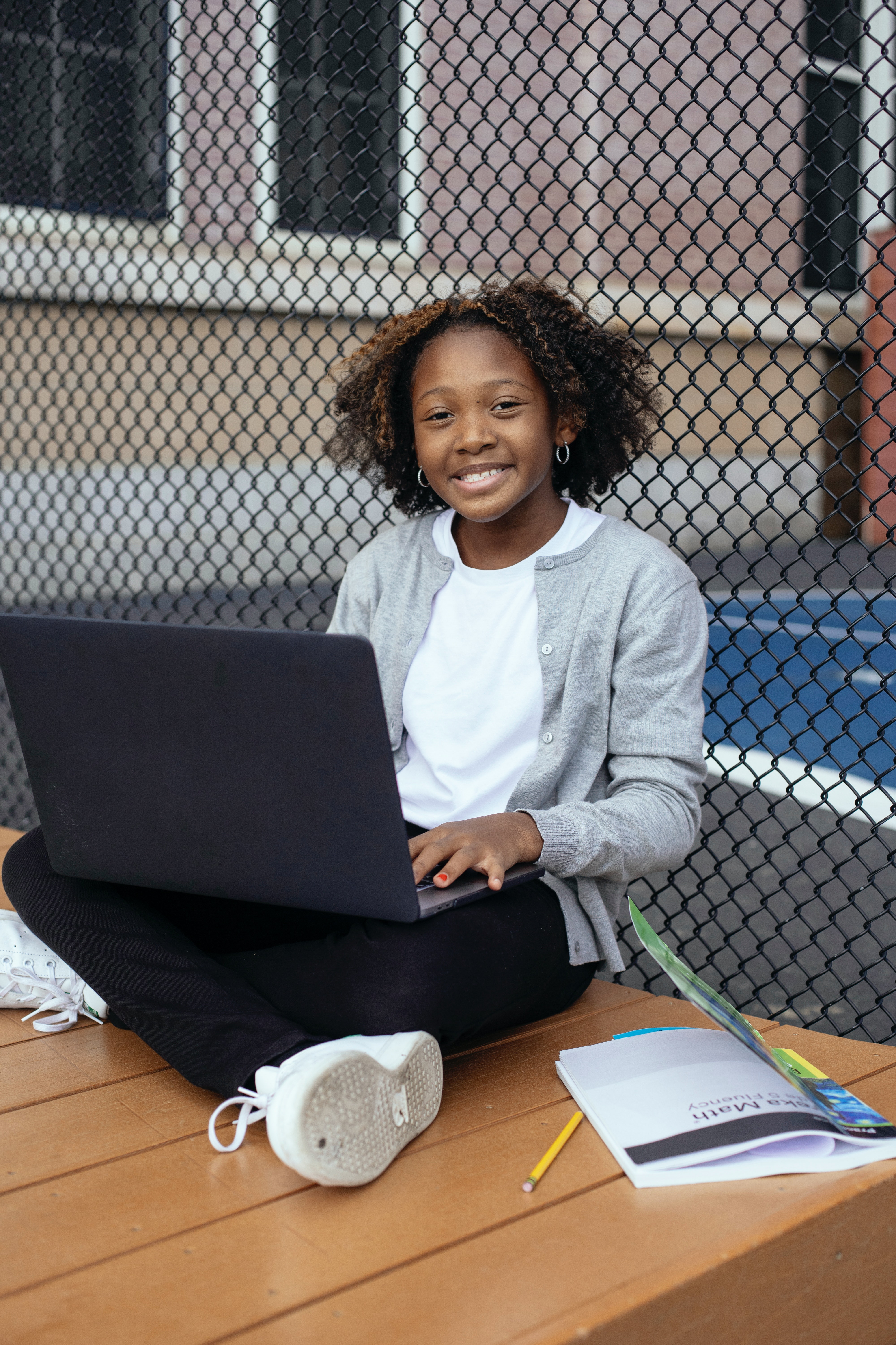 Student studying happily with laptop