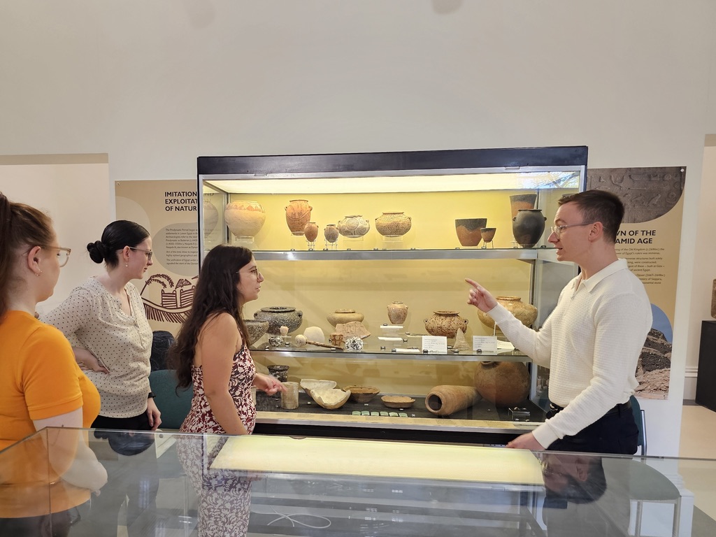 Jordan teaching at museum with ancient pottery