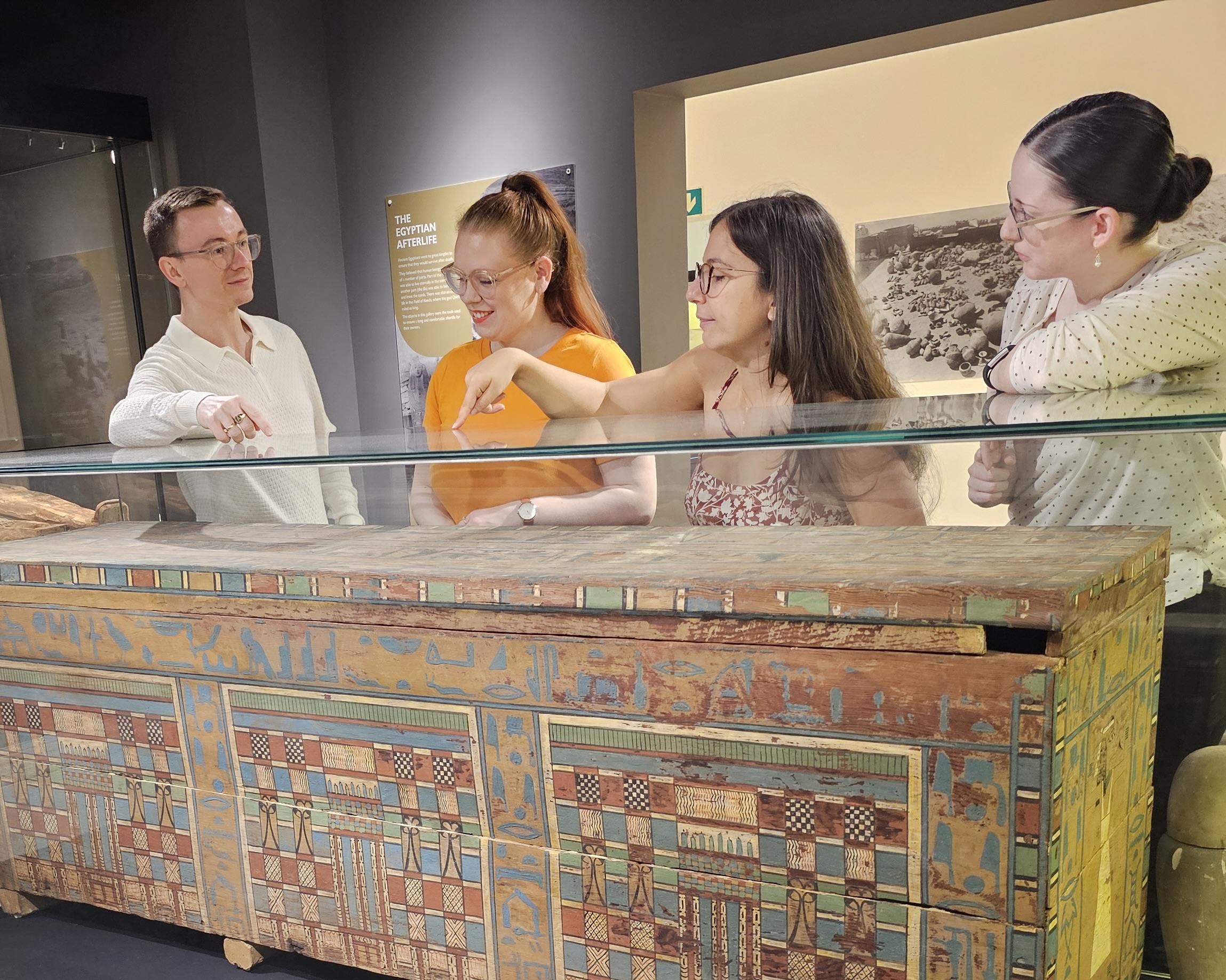 Examining Egyptian artefacts at museum